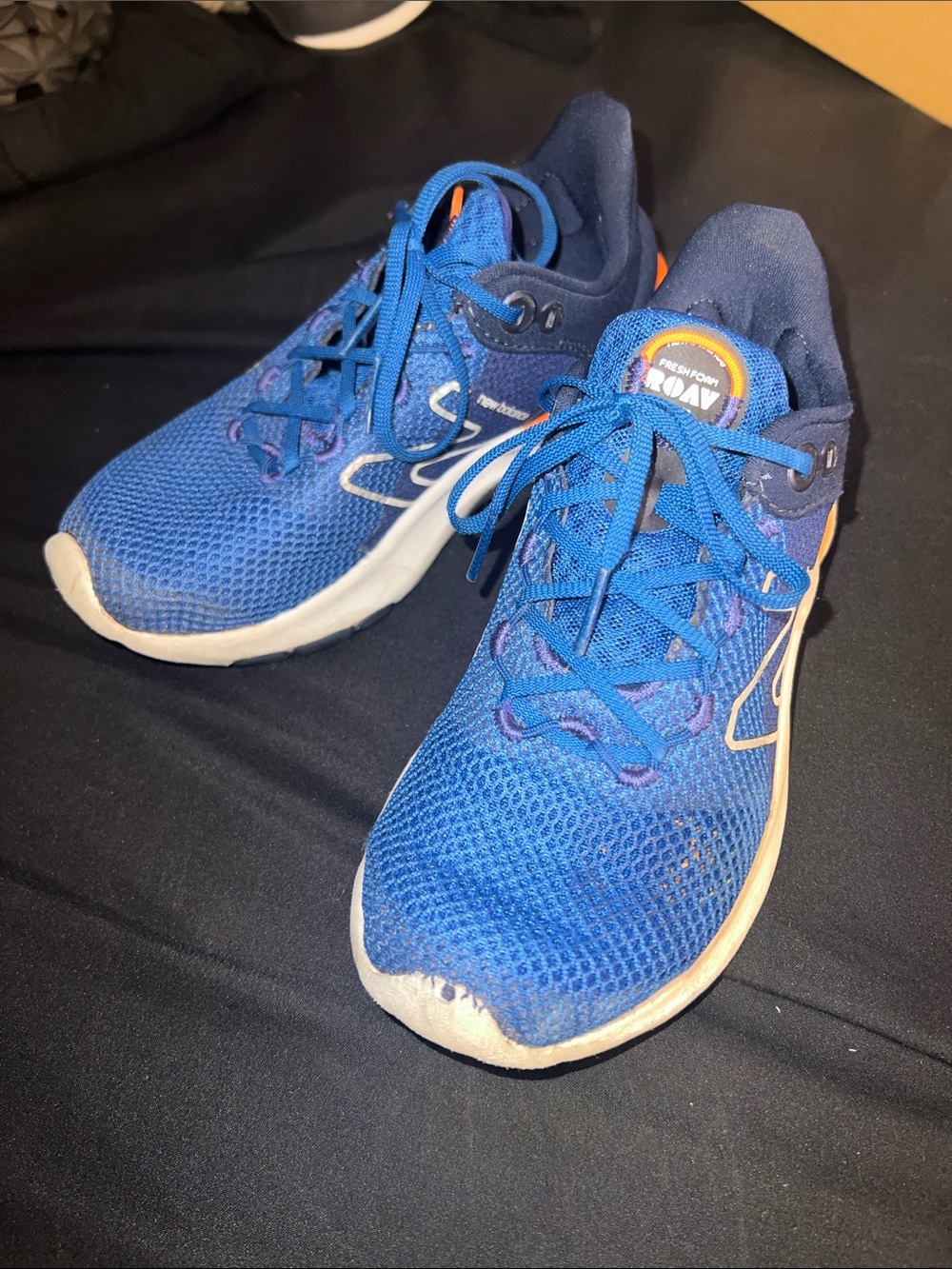 Blue New Balance Running Shoes with Orange Accents